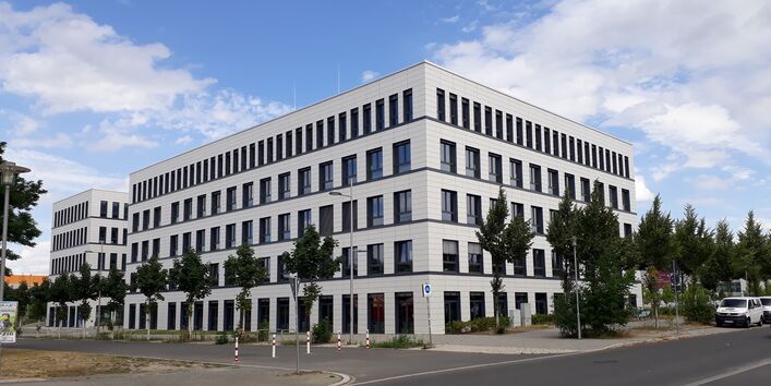 five-story office building at a street intersection