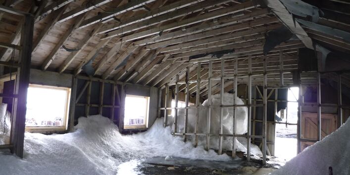 historical building in the antarctic with snow