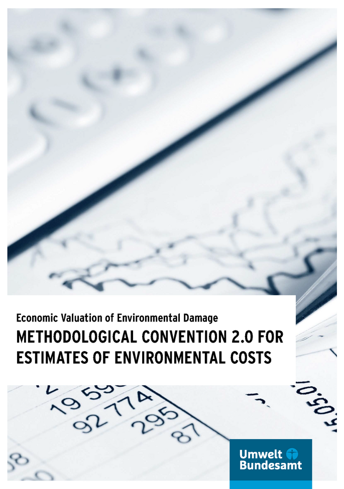Cover of the publication "Economic Valuation of Environmental Damage" with the logo of the Umweltbundesamt, in the background a photo of a curve chart and a table lying beside a keyboard