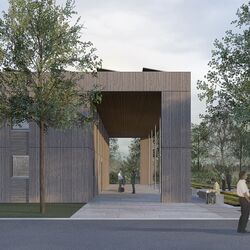 kubusförmiger Holzbau mit Arkaden und Solarzellen auf dem Dach