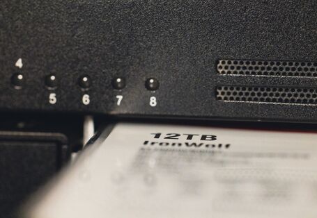 Close-up of a hard disk in a network-attached storage (NAS).