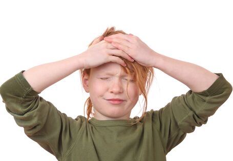 A child that holds its head.