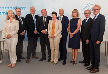 group of man and women posing for a photo