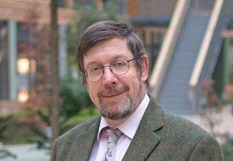Dr. Klaus Günter Steinhäuser in the atrium of the UBA office building Dessau-Roßlau