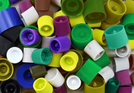 Many different coloured caps from tubes.