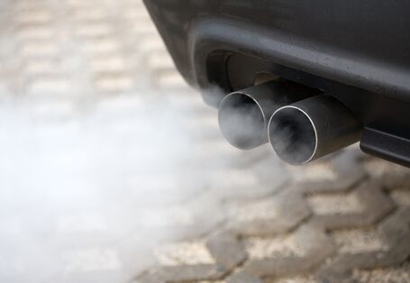 exhaust pipe of a car emitting exhaust gases