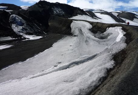 •	A real-life black and white picture: icy surfaces alternate with loose rock