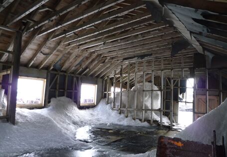 historical building in the antarctic with snow