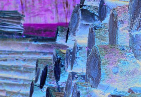 The picture shows a stack of timber.