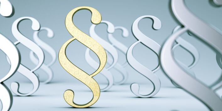 Grafik: Paragraphenzeichen als Symbol für Gesetzgebung.