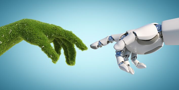 Bild zeigt eine Roboter- und eine Pflanzenhand, die sich berühren. 
