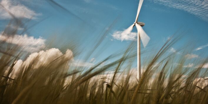 Wind power station in a crop field