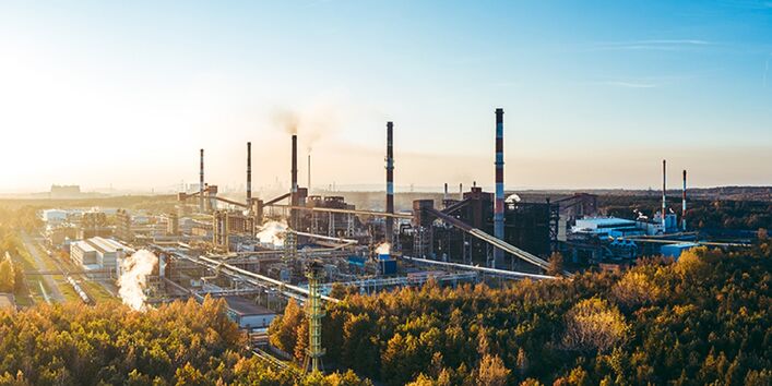 A factory surrounded by forest.