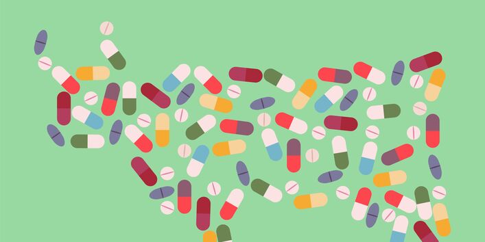 Bunte, illustrierte Pillen und Kapseln bilden die Umrisse einer Kuh vor einem mattgrünem Hintergrund