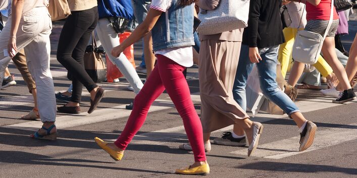 Detailed photograph Pedestrians crossing a street with zebra crossings