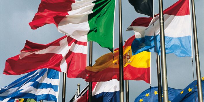 Waving flags of Switzerland, Greece, Spain, Luxembourg, Italy, the Netherlands, Portugal, the United Kingdom, Belgium and the European Union